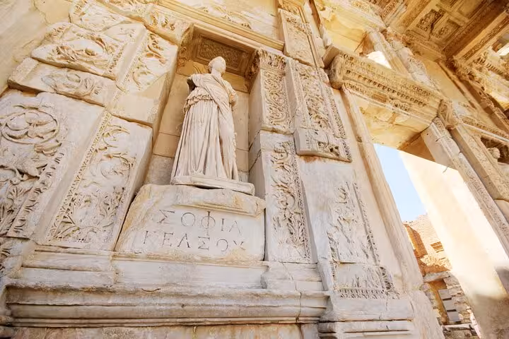 Carved marble statue and reliefs at Ephesus, Turkey, detailed Roman architecture on 10-day Turkey tour