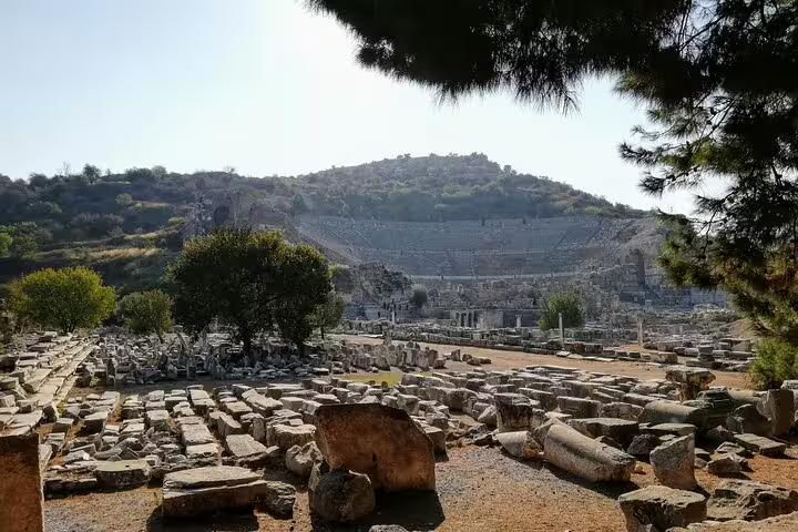 Great Theatre of Ephesus and scattered marble ruins on all-inclusive private Ephesus tour from Istanbul