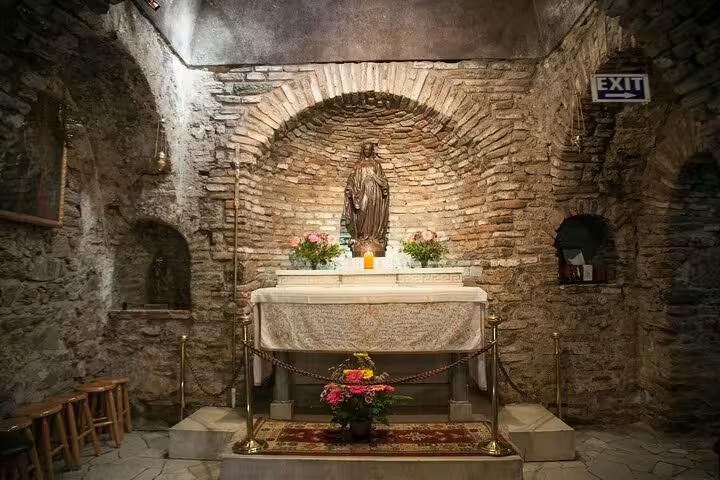 Visit the serene interior of the House of the Virgin Mary, featuring a sacred altar, on our exclusive Ephesus tour.