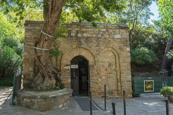 Visit the serene House of Virgin Mary nestled in lush greenery on our Ephesus tour with lunch included.
