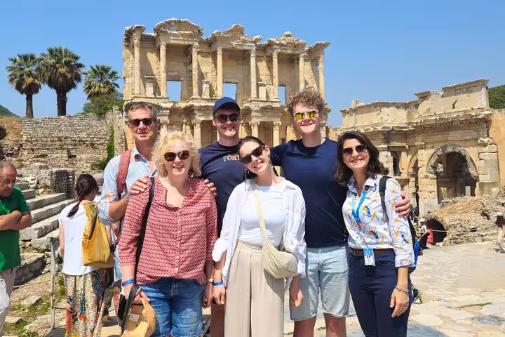 Happy group photo at the Library of Celsus on Ephesus tour from Izmir hotels with local guide