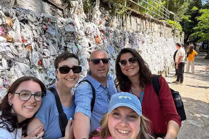 Group selfie at House of Virgin Mary wish wall, a stop on Ephesus tour from Izmir hotels with guide