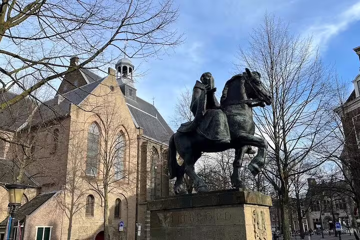 Equestrian statue at Janskerkhof with church backdrop in Utrecht, featured on the self-guided GPS highlights tour