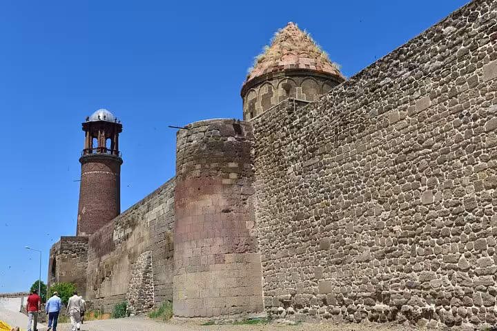 Erzurum city walls and historic watchtower under blue sky on a private guided walking tour in Turkey