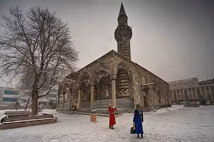Snowy Erzurum city walking tour at Lala Mustafa Pasha Mosque, Turkey, with minaret and winter scene