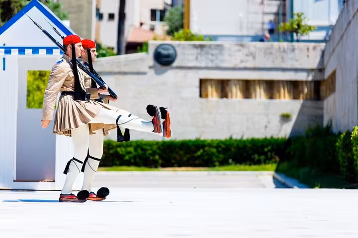 Evzones guards performing ceremonial march at the Tomb of the Unknown Soldier in Athens during private tour.