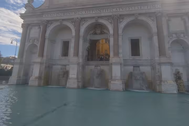 Stunning historic fountain with classical architecture, ideal stop for exclusive enogastronomy tour in Italy.