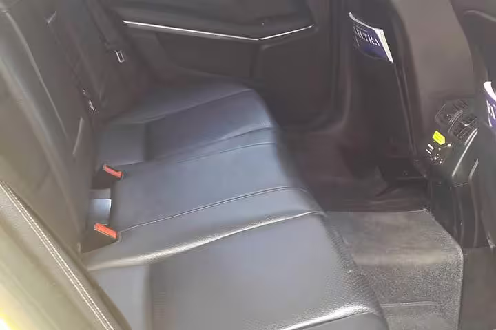 Spacious leather rear seats in executive sedan for private Athens to Thessaloniki transfer with WiFi