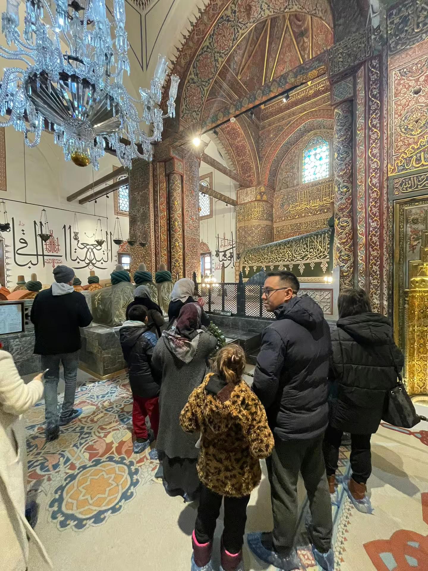 Visitors inside ornate Eyup Sultan Mosque in Istanbul, cultural highlight on Turkey Delights private 10-day guided tour