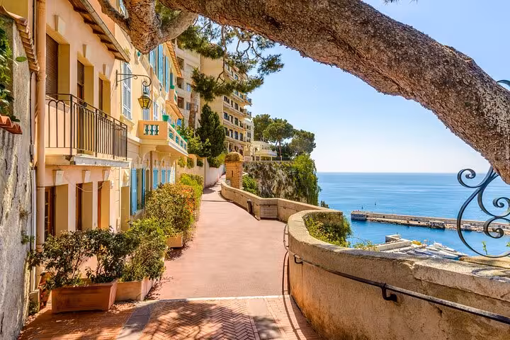 Stroll along the picturesque coastal path in Eze, offering stunning views of the Mediterranean Sea and charming buildings.