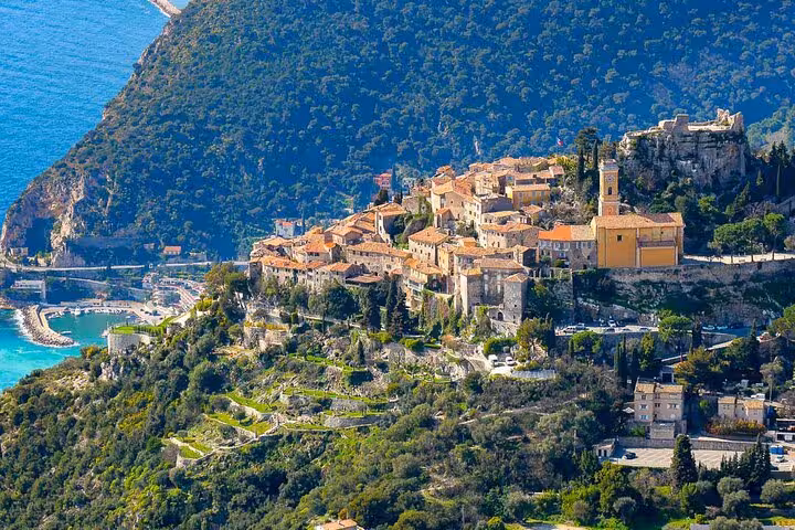 Scenic aerial view of Eze Village perched on a hilltop overlooking the Mediterranean Sea, a highlight of the Monaco tour.
