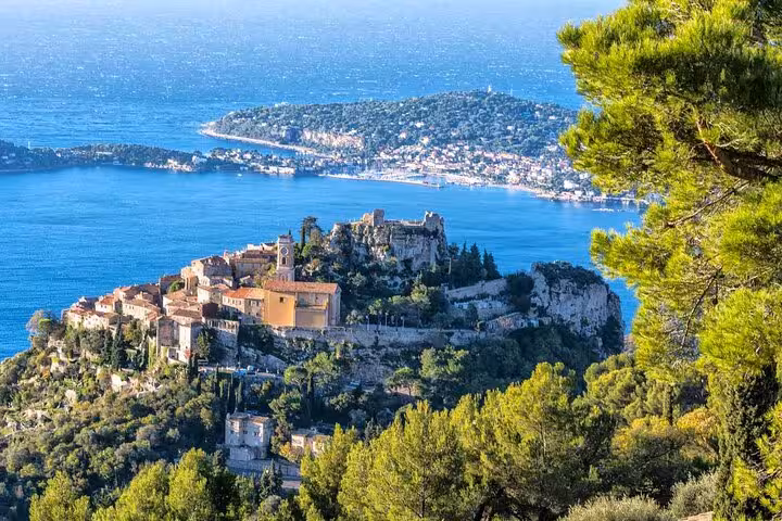Scenic view of Eze village perched on a hill with the Mediterranean Sea in the background, ideal for Monte Carlo tours.