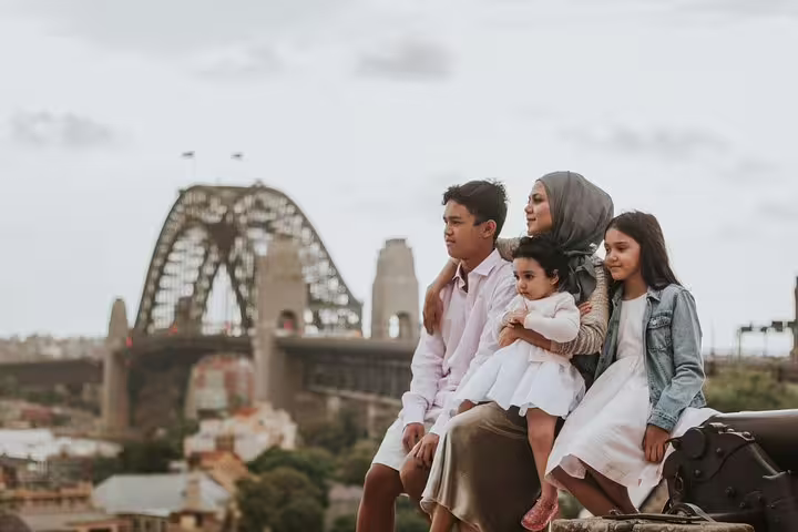Family portrait with Sydney Harbour Bridge backdrop on a private Sydney travel photographer tour and photoshoot