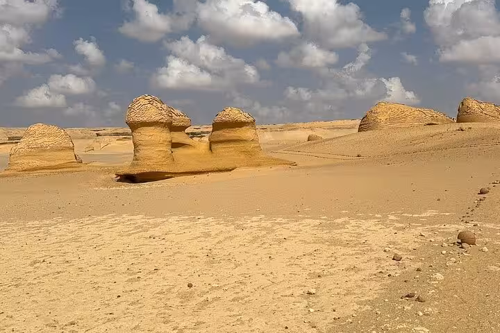 Wind-carved desert rock formations in Fayoum Oasis, a highlight of a private full-day tour from Cairo