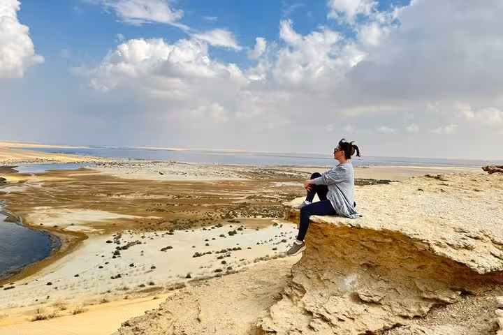 Private Fayoum Oasis tour from Cairo with guide, family at Lake Qarun viewpoint and desert landscape backdrop