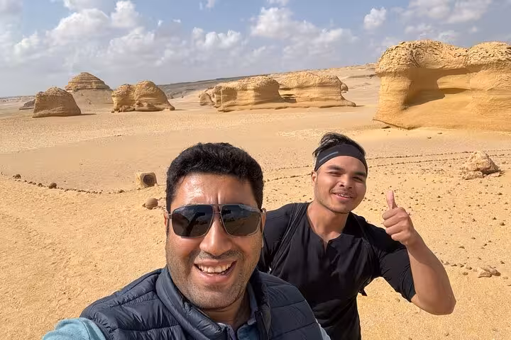 Travelers selfie at Wadi El Hitan rock formations on a Fayoum Oasis private full-day tour from Cairo