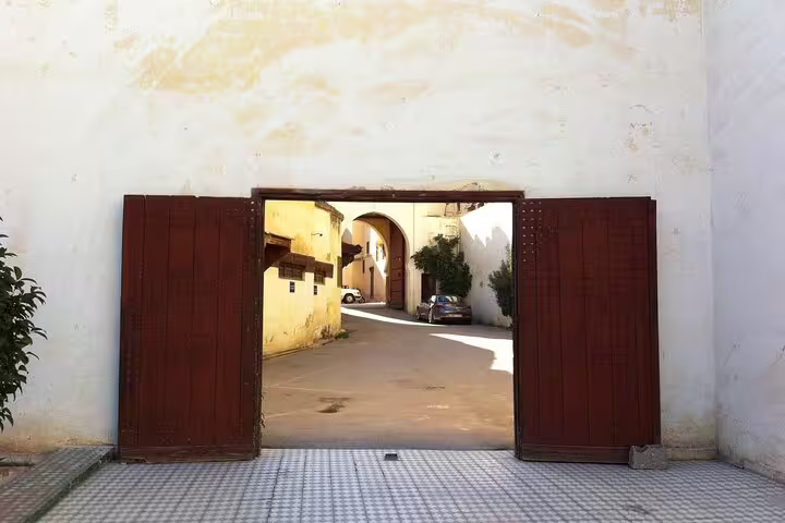 Historic gate opening to a quiet lane in Fes, Morocco, a highlight of Your Own Morocco self-guided city tour