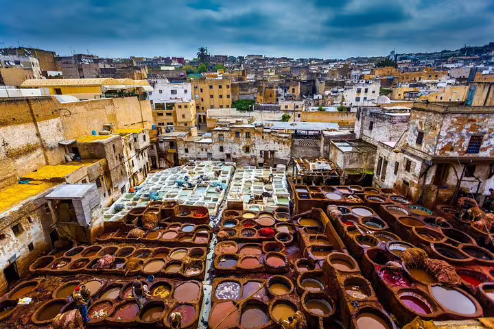 Colorful Fez Chouara Tannery dye vats, guided stop on Morocco 9 days tour from Marrakech