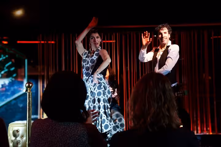 Energetic flamenco dancers captivate the audience with traditional moves at a live show in Barcelona.