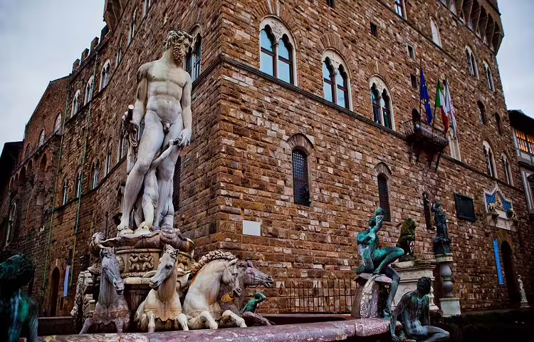 Neptune Fountain and Renaissance statues in Piazza della Signoria, a highlight of the Florence and Pisa tour from Rome