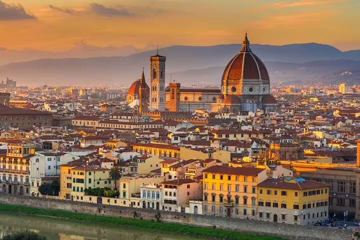 Stunning view of Florence skyline at sunset, perfect starting point for private transfer to Pisa Airport.
