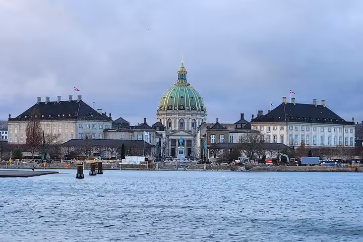 View of the iconic Frederiks Church from across the harbor, ideal for cultural immersion on a walking tour in Copenhagen.