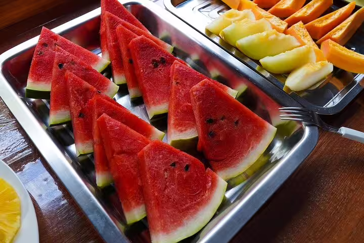 A platter of fresh watermelon slices served at Amazon Mamori Lodge, highlighting local, tropical dining experiences.