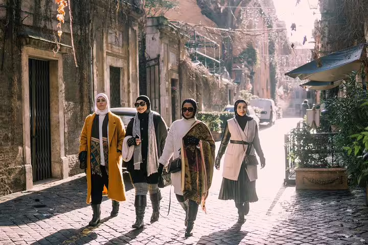 Friends strolling a historic street on a private Milan travel photographer tour, candid lifestyle portraits
