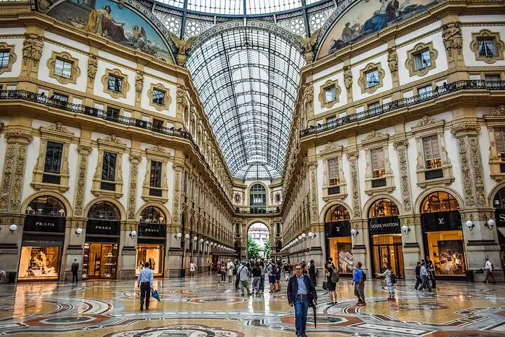 Elegant interior of Galleria Vittorio Emanuele II in Milan, showcasing luxury shops and stunning architecture on a private tour.