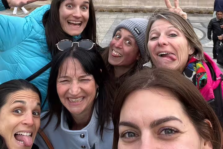 Smiling team selfie on a Geneva scavenger hunt and city highlights walking activity, celebrating completed clues