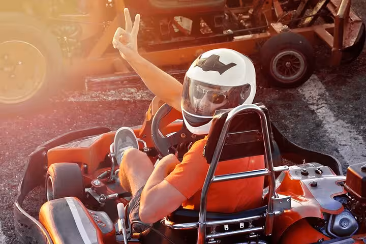 Helmeted driver in red go-kart at Ghibli Raceway, Sharm El-Sheikh day trip with hotel pickup