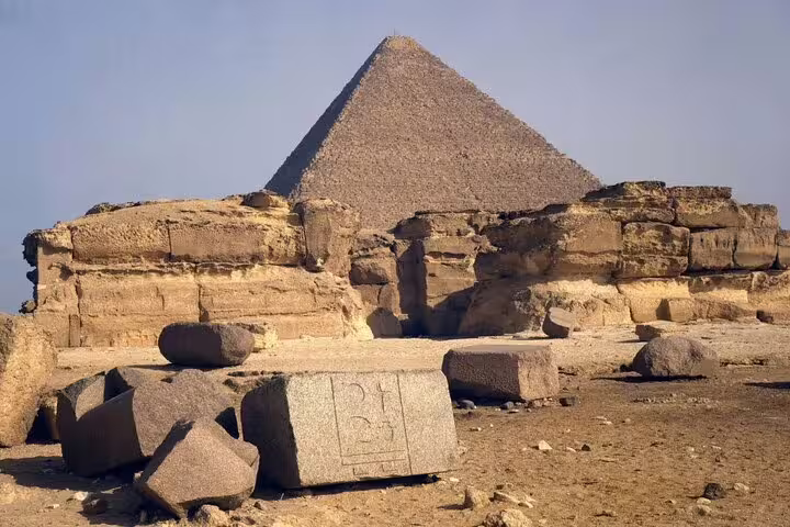Giza Pyramid behind ancient stone blocks on private minivan day tour to Pyramids of Giza and Egyptian Museum