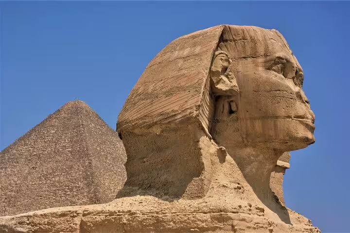 Great Sphinx and Giza Pyramid under clear blue sky on private tour from El Sokhna Port to Cairo and Khan El Khalili
