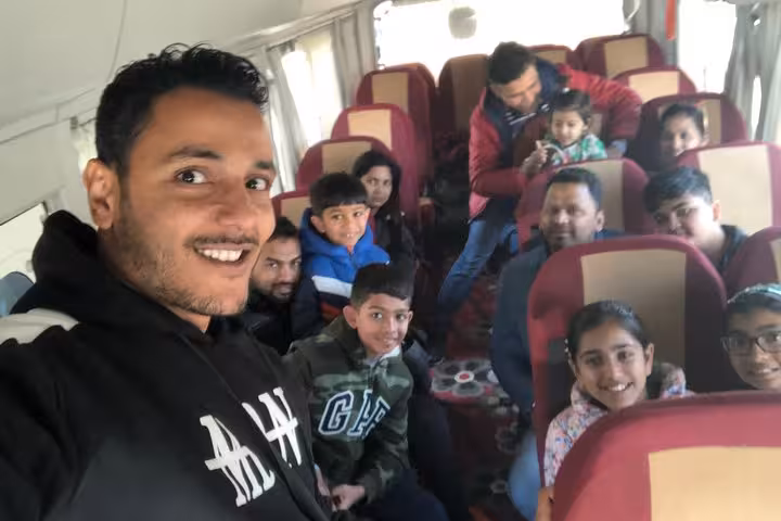 Group transfer bus selfie with guide for Giza Great Pyramid interior, Sphinx, Saqqara and Serapeum day tour