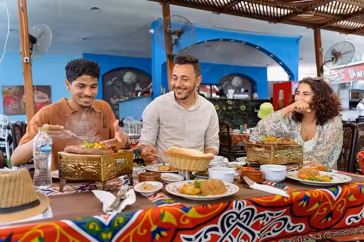 Tour guests enjoying Egyptian lunch at a local restaurant after Giza Pyramids, Sphinx and Saqqara Serapeum visit