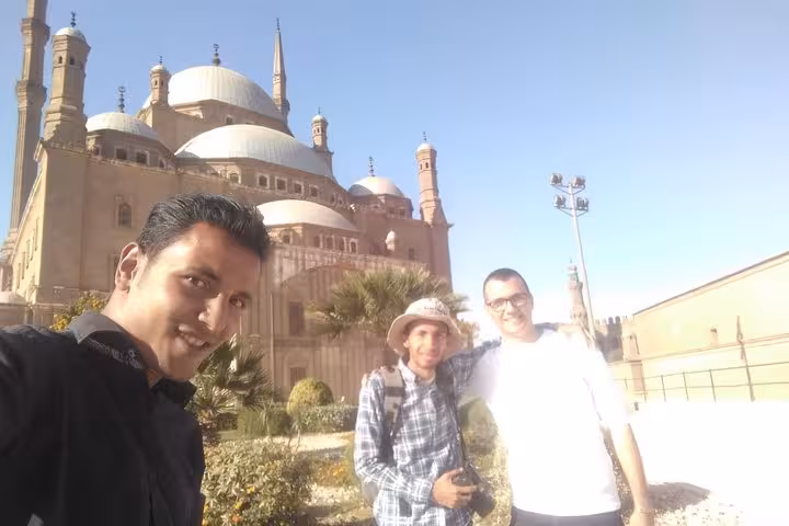 Travelers pose with guide at Cairo Citadel and Mohamed Ali Mosque on a Giza Pyramids day tour