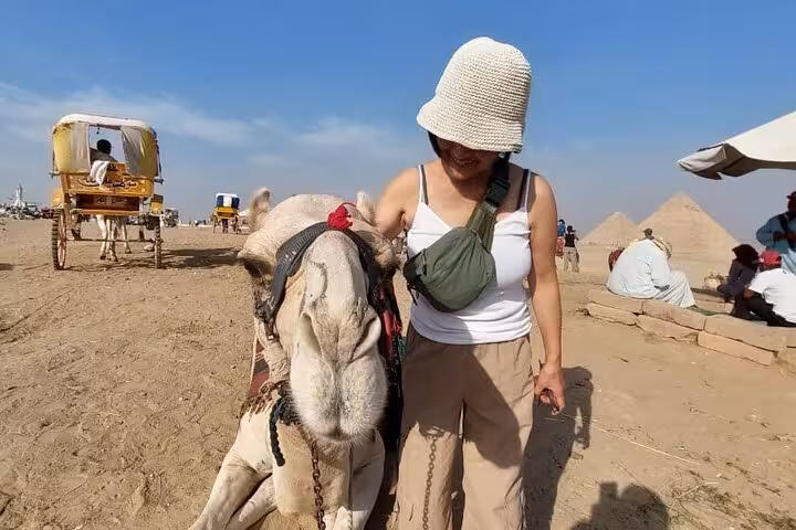 Traveler with camel at Giza Pyramids desert, private tour with quad bike ride, lunch and entrance tickets