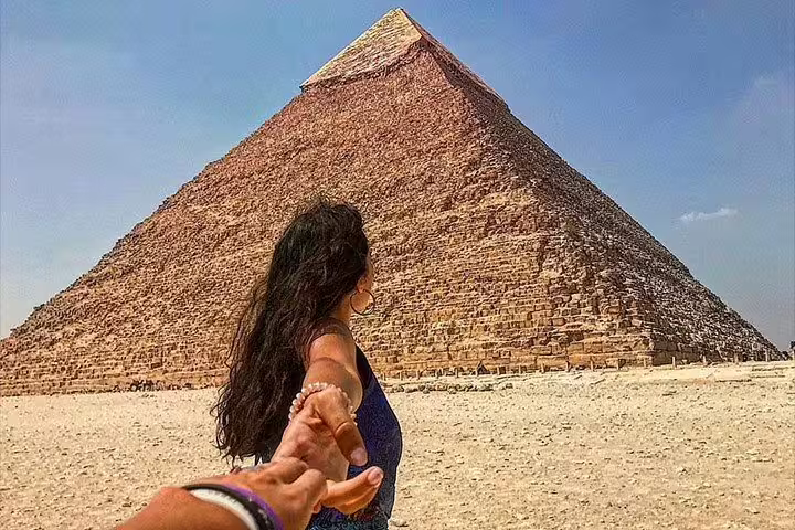 Follow-me view at the Great Pyramid of Giza, Egypt day tour experience with camel ride option from Cairo
