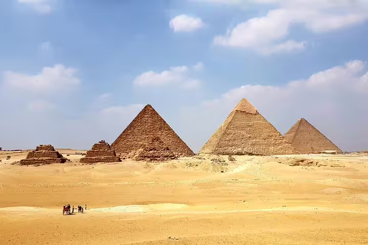 Wide view of the Giza Pyramids in the desert, Egypt, featured on a private pyramids and museum tour
