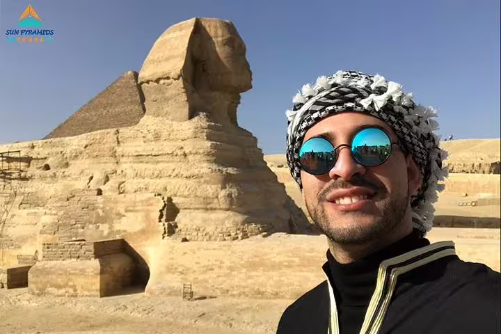 Traveler selfie by the Great Sphinx and Giza Pyramids on Cairo day tour to Memphis, Saqqara and Dahshur