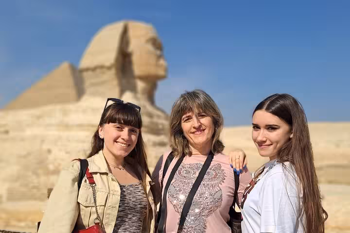 Group photo with the Great Sphinx in Giza on an all-inclusive full-day pyramids, mummies museum and bazaar tour