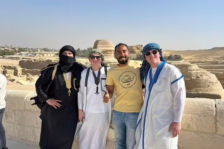 Tourists with local guide at the Great Sphinx viewpoint on a Giza Pyramids half-day tour in Cairo