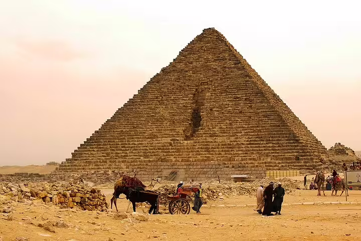 Horse-drawn carriage at the Great Pyramid of Giza on a half-day tour across the desert plateau