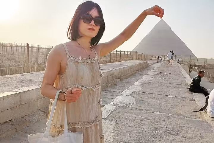 Visitor at Giza Pyramids viewpoint on private trip with tickets, quad bike adventure, camel ride and lunch included