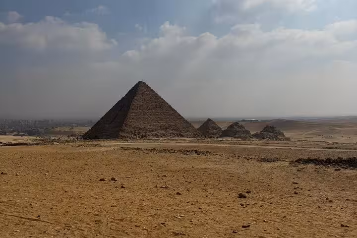 Wide desert view of Giza Pyramids near Cairo, a highlight of private tour with Sphinx and Grand Egyptian Museum