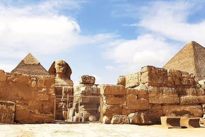 Great Sphinx and Giza Pyramids panorama on private Cairo tour, ancient stone walls and desert courtyard view