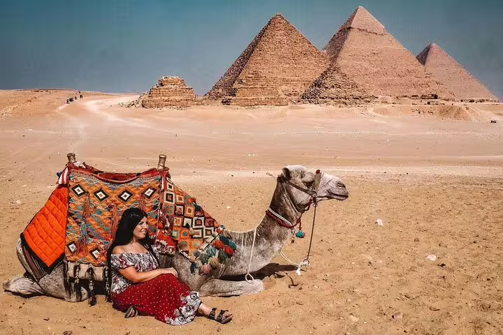 Relaxing by a camel near the Giza Pyramids, private 3-hour tour with camel ride and Sphinx visit