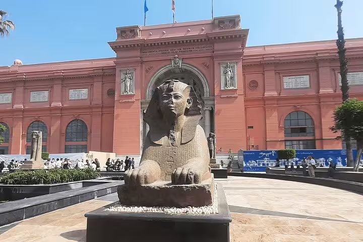 Egyptian Museum Cairo entrance with sphinx statue, private tour stop on Giza Pyramids and Sphinx day trip