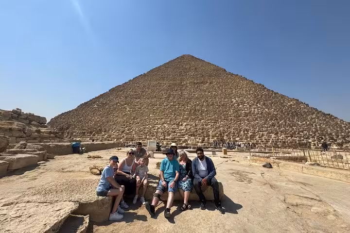 Group photo at the Great Pyramid of Giza on a private tour to the Pyramids, Sphinx and Grand Egyptian Museum