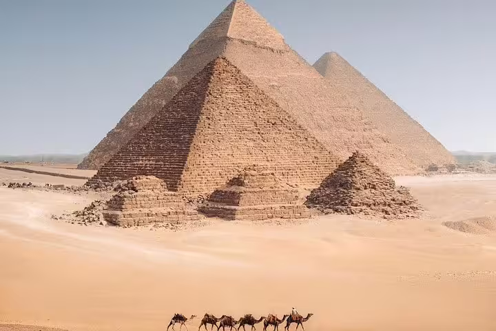 Panoramic view of the Giza pyramids in the desert with camel caravan, private guided tour with tickets included
